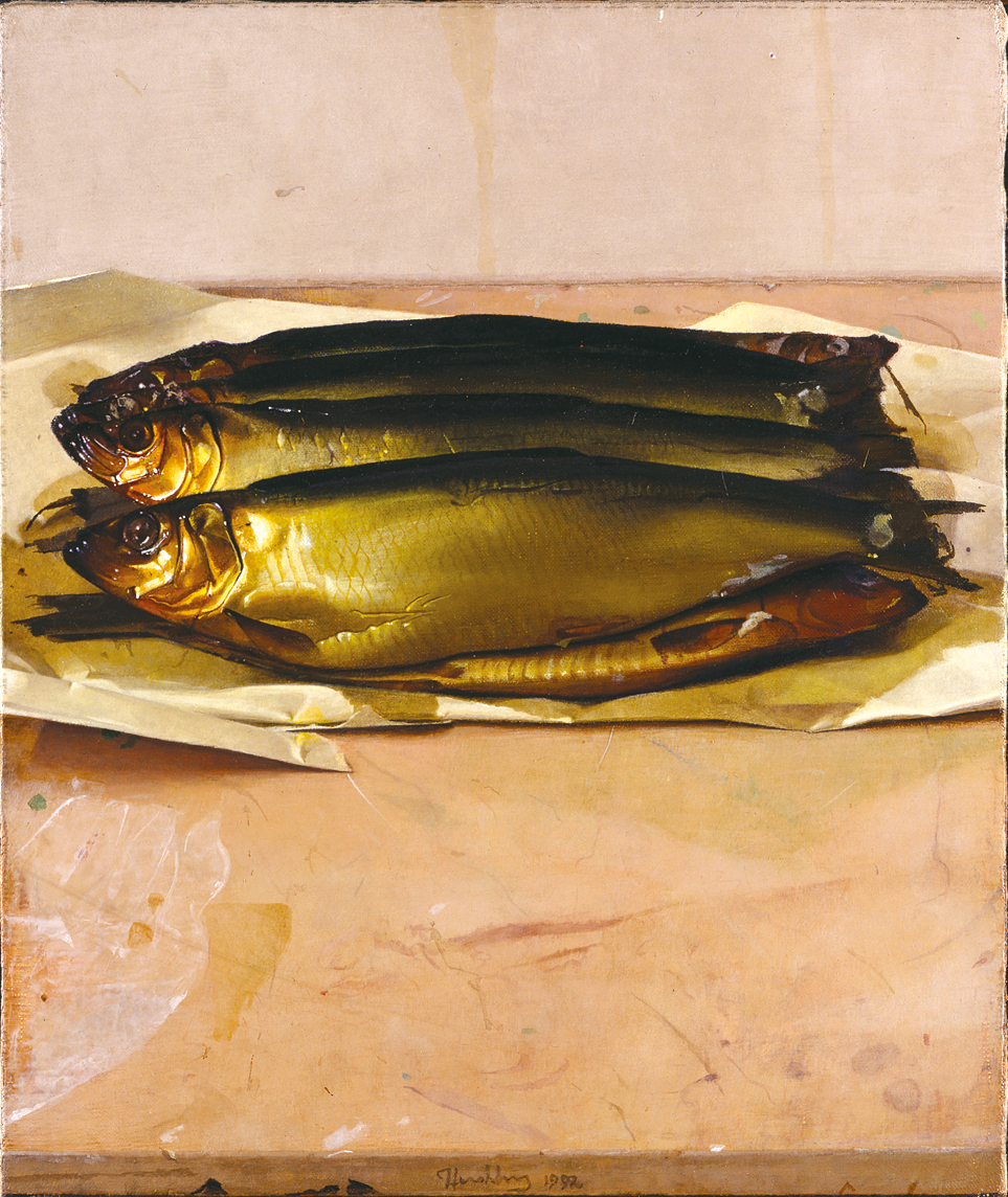 Painting of four fish on paper on a table. 