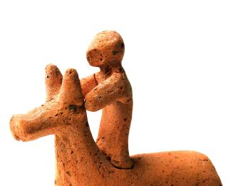 Terra-cotta figurine of horse and rider.