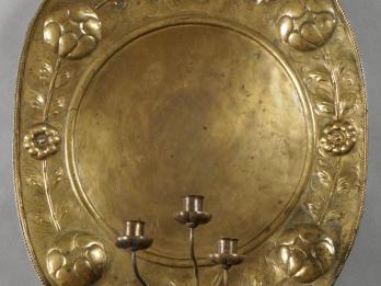 Metal oval with three candlestick holders. 