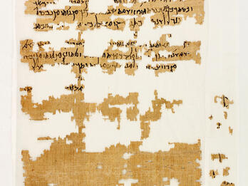 A fragmentary ancient papyrus manuscript with Greek text in black ink. The papyrus is yellowed and torn, with large missing sections.