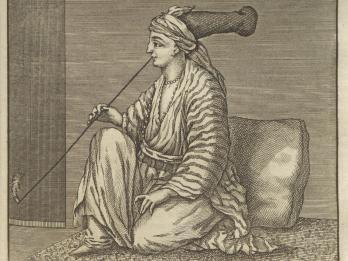 Print of seated person in large hat and robes facing to the left smoking a very long pipe. 