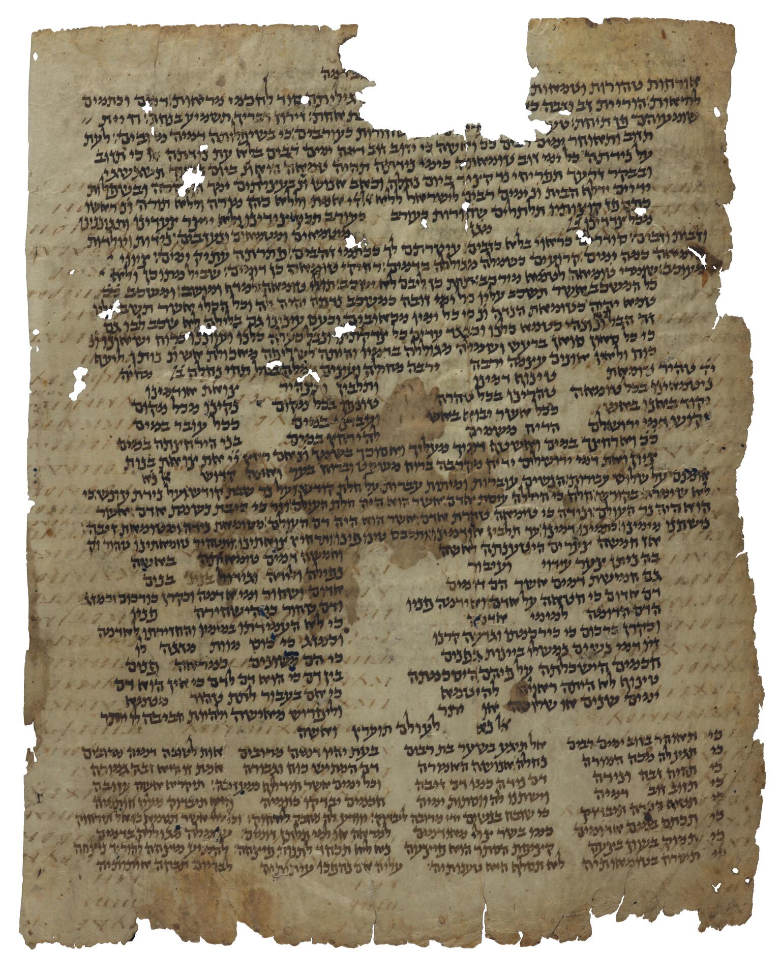 Damaged manuscript page with Hebrew script arranged variously in paragraphs and columns, mostly in black ink with some in brown, with holes obscuring some of the text.