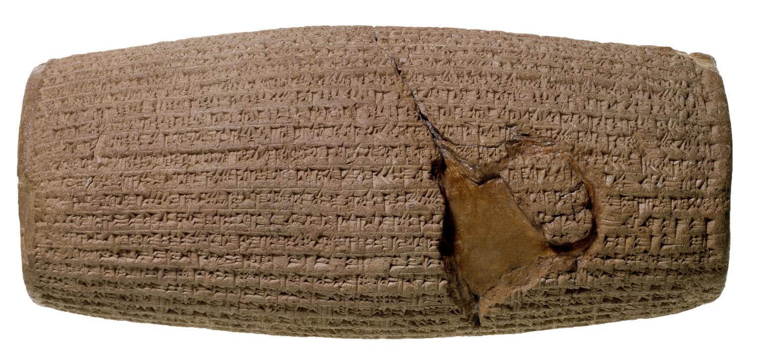 Stone cylinder inscribed with cuneiform.