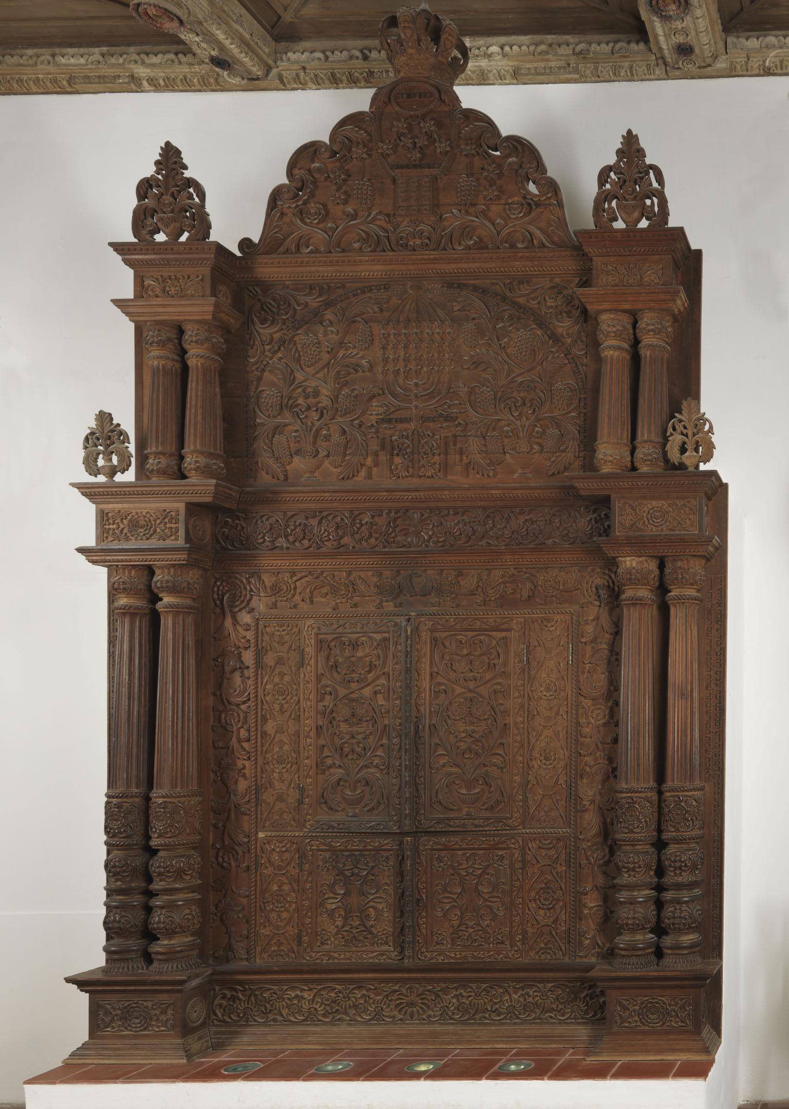 Close-up photograph of carved wood Torah ark.