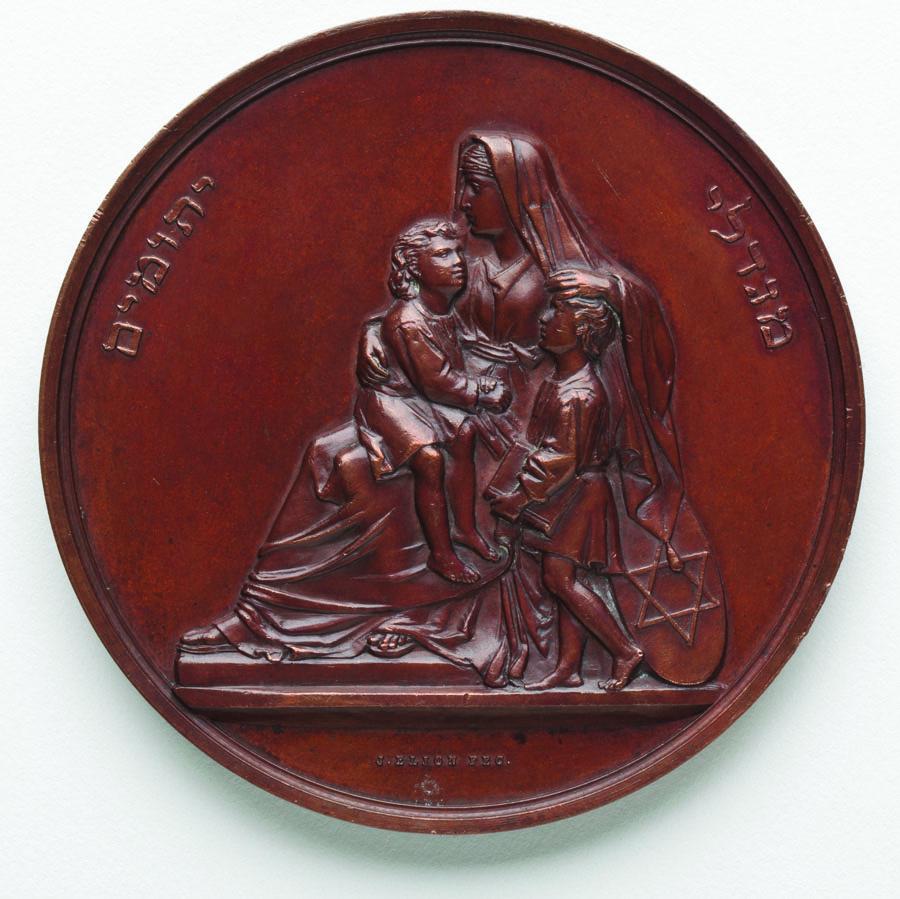Medal depicting woman with children.