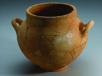 Ceramic pot with two handles and Hebrew inscription.