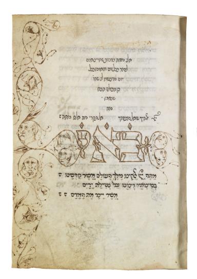 Manuscript page with Hebrew writing in triangular pattern on top, large Hebrew word in center, some Hebrew text below, and faces drawn on left margin. 