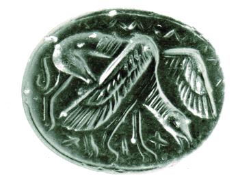 Stone seal decorated with grazing griffin with partially spread wings and bovine body.