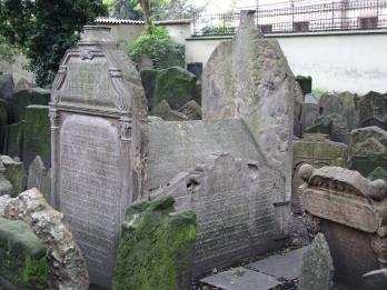 Tomb with high tombstones on either end, with Hebrew inscriptions on outside of all sides. 
