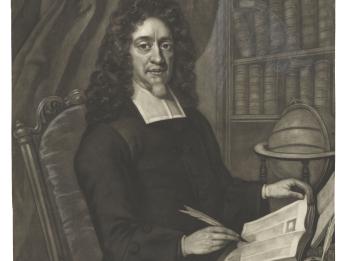Portrait of a bearded man seated at desk wearing a wig and collar, holding a quill in his right hand and turning the page of book with his left hand, with bookshelf in background and globe and inkwell on desk. 