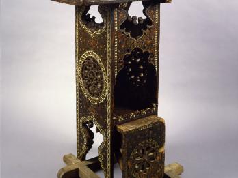 Wooden lectern with geometric designs.
