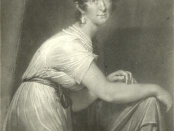 Painting of woman sitting sideways on a chair, with arms draped over the chair back and facing viewer, wearing short-sleeved dress, pearls, sash, and a curly updo. 