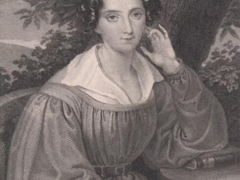 Engraving of woman seated in front of a tree at a table, facing the viewer with her left elbow resting on the table and her right hand holding a book in her lap.