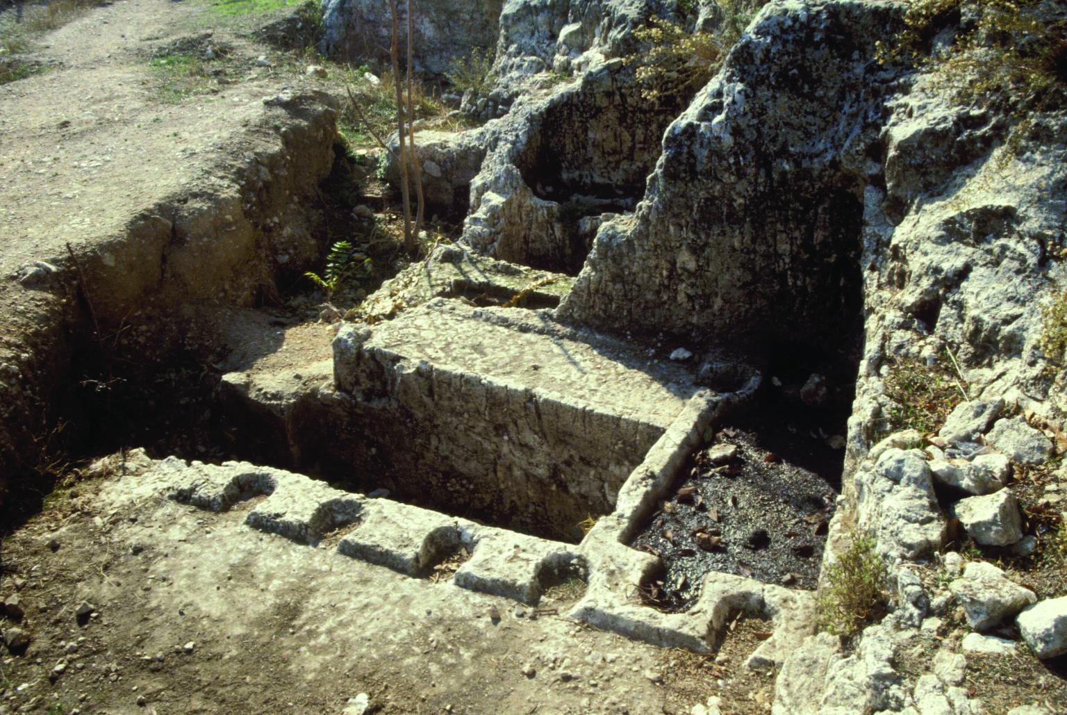 Aerial photograph of tomb built into ground.