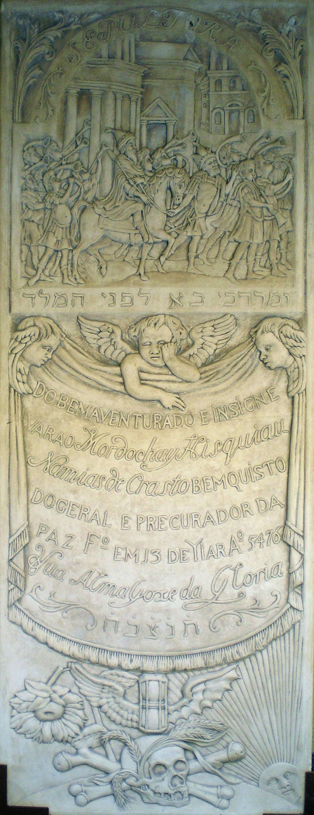 Tombstone of three cherubs and central Portuguese inscription, with engraving of wilted flower, skull, hourglass, and sun, with top panel of engraving of man riding in a procession through street and Hebrew text across the middle. 