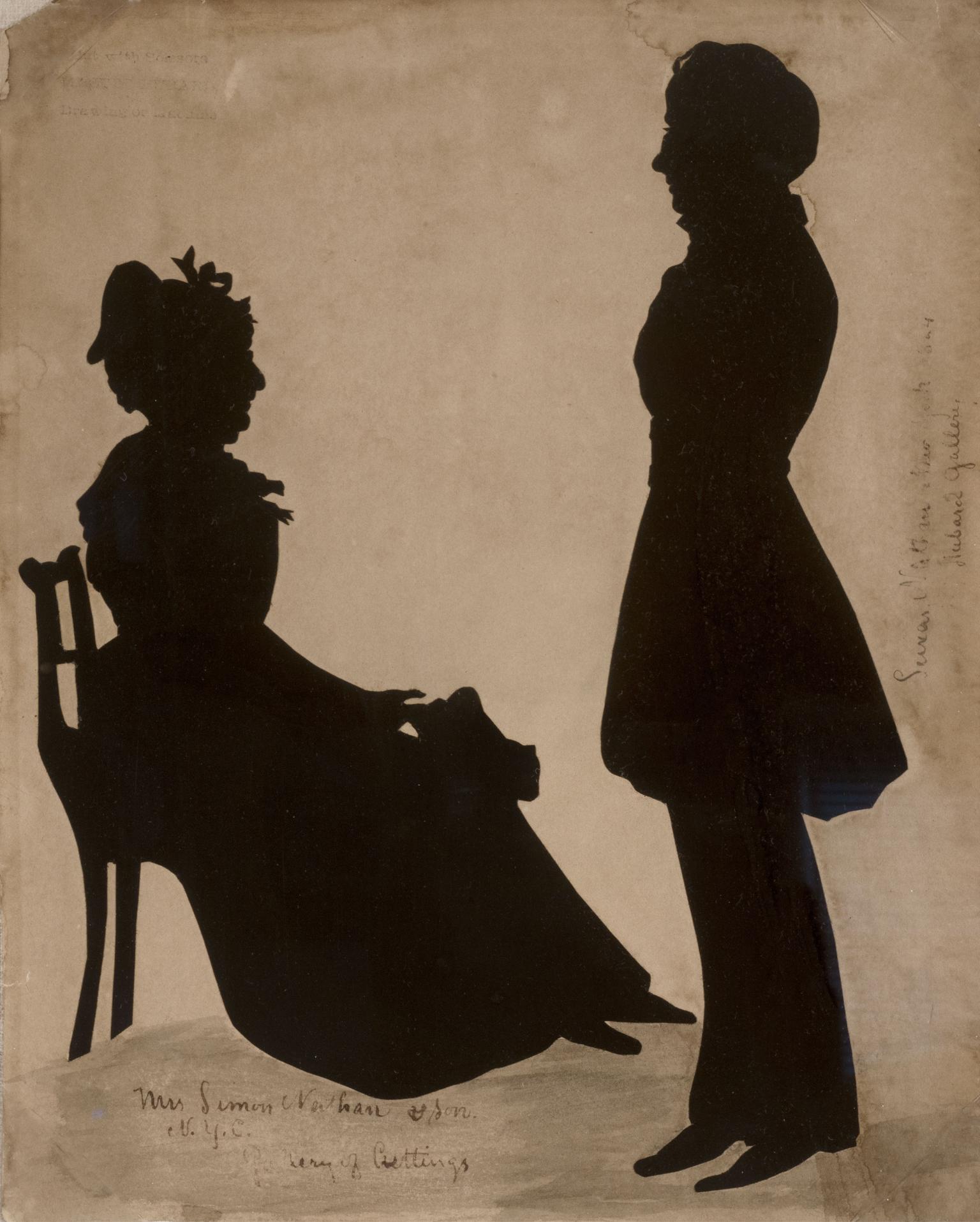 Silhouette portrait of a seated woman and a boy, standing.