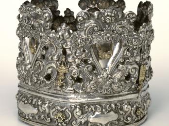 Crown with decorative carvings.