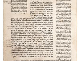 Printed page with Hebrew text and decorated Hebrew word in top register. 