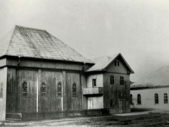 Exterior photograph of wooden building. 