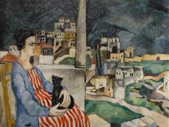 Painting of woman sitting on balcony with cat in her lap overlooking the city.