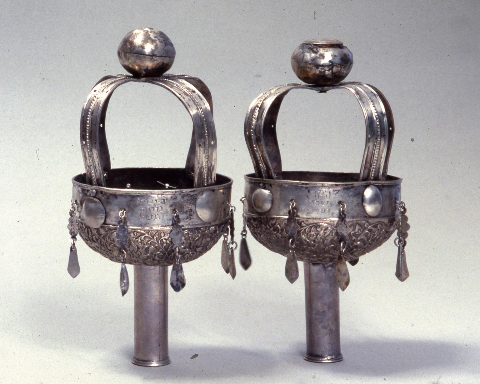 Pair of finials with balls on top.