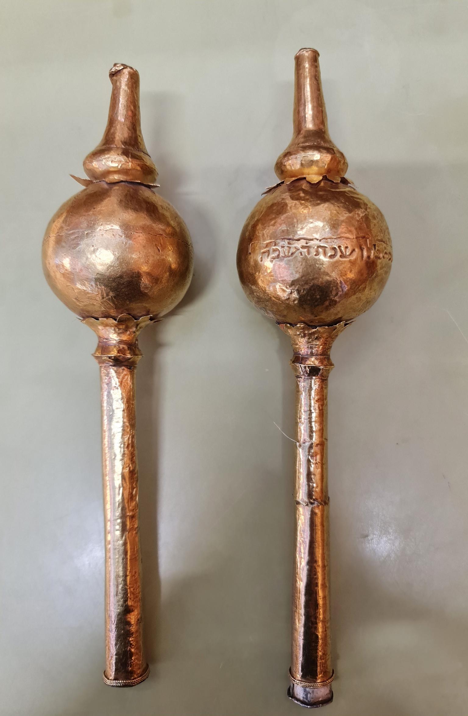 Two finials with Hebrew inscription on one. 