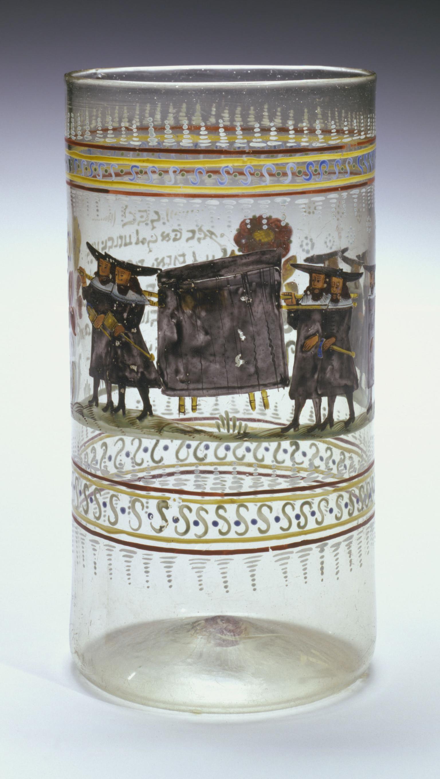 Glass beaker with painting of figures carrying enclosed stretcher.