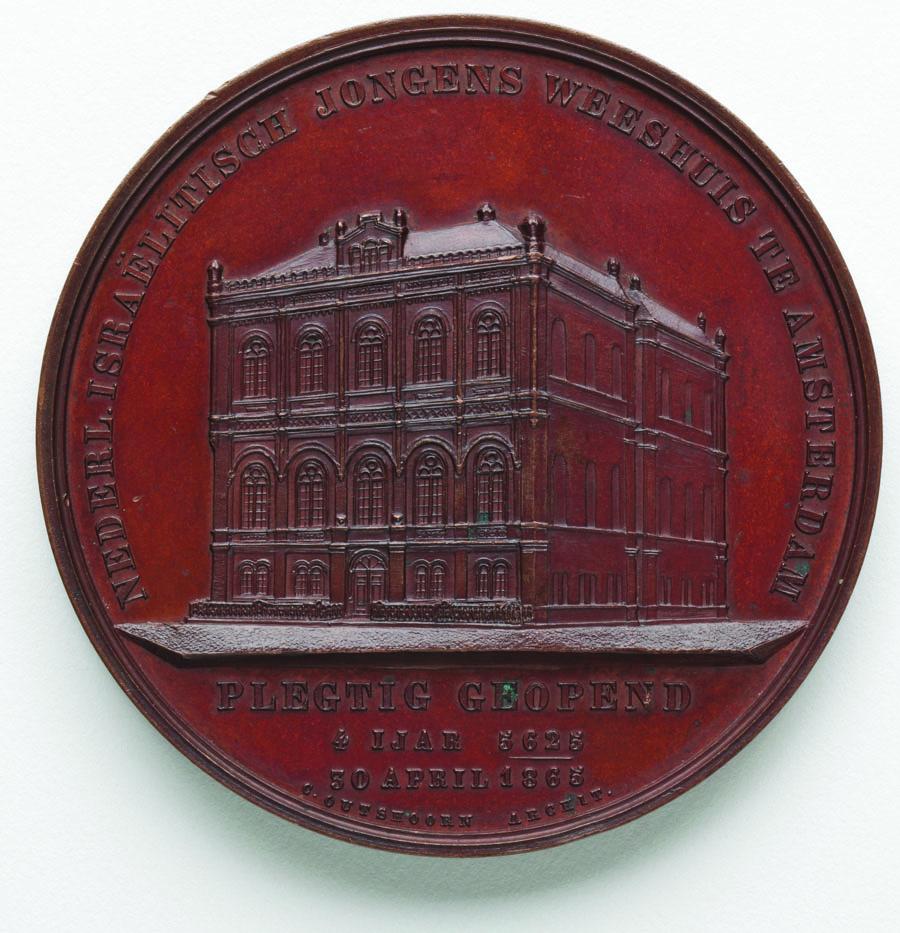 Medal depicting building.