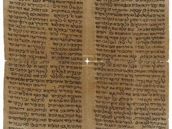Aged parchment with four columns of Hebrew script written in black ink.