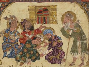 Illustration of four turbaned, haloed men in front of a bookshelf reading and discussing books and gesturing toward a fifth standing white-bearded man with a staff.