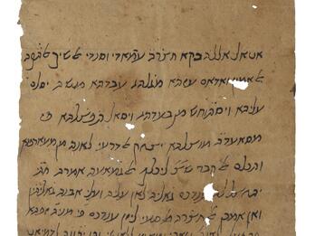 Damaged parchment with handwritten vowelless Hebrew on the bottom two-thirds and several small holes.