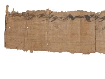 Long and narrow papyrus fragment with Hebrew writing on top. 