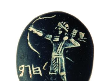 Seal with carving of archer shooting a bow and Hebrew inscription.