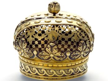 Gold crown decorated with floral motifs.