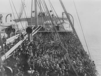 A ship deck filled with people.
