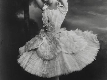 Photograph of ballerina on pointe wearing tutu.