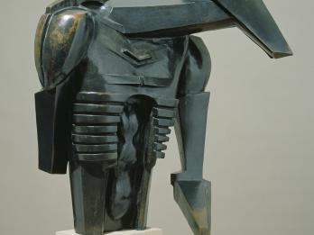 Bronze sculpture of angular shapes resembling a torso.