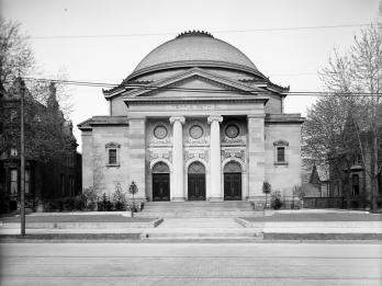 Photograph of exterior of building with domed roof.