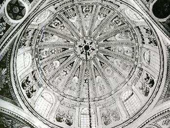 Photograph of domed ceiling covered with geometric shapes, including Stars of David.