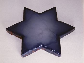 Sculpture of solid Star of David. 
