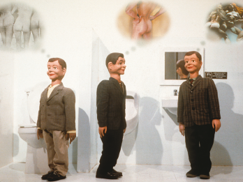 Three dolls in a bathroom with thought bubbles above their heads with images of multiple perspectives of the human buttocks. 