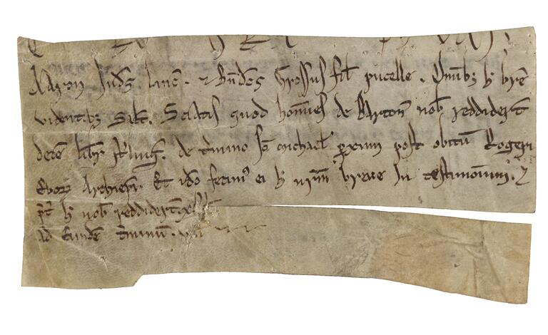 Fragment of parchment with six lines of Latin script, and additional text cut off at the top, with the last two lines shorter and next to a tear across the page.
