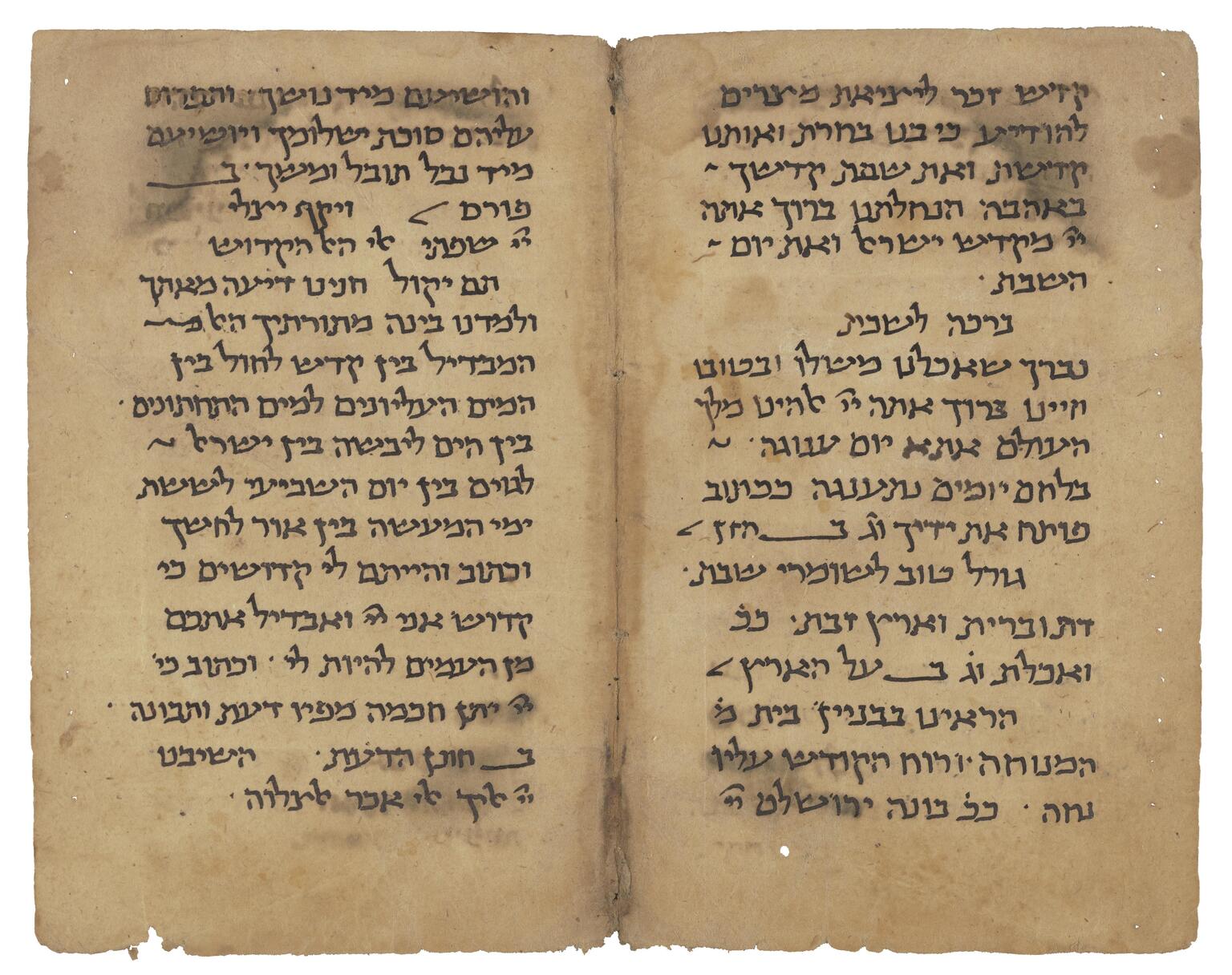 Facing manuscript pages in Hebrew script on lightly stained and damaged parchment.