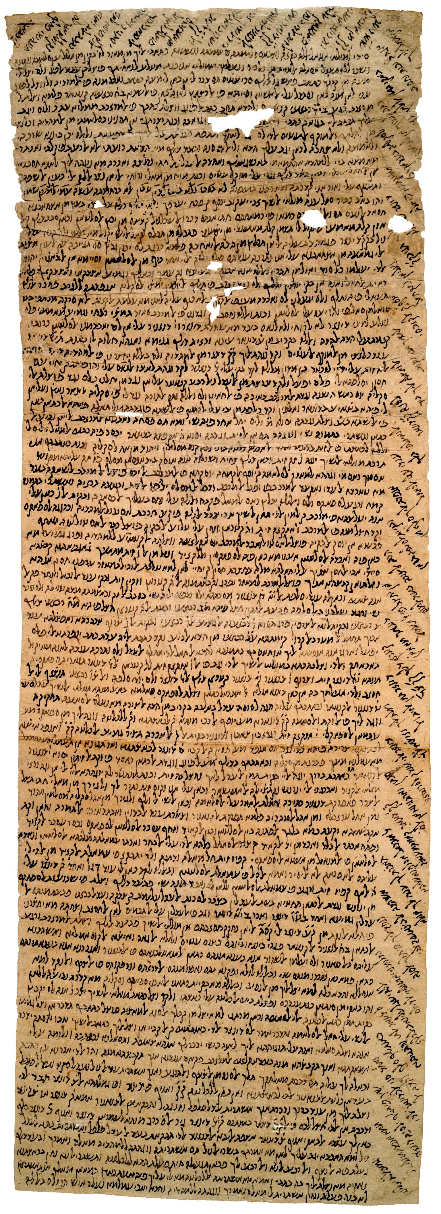 Damaged, long parchment densely filled with vowelless Hebrew writing, including diagonal lines filling the top and right margins.