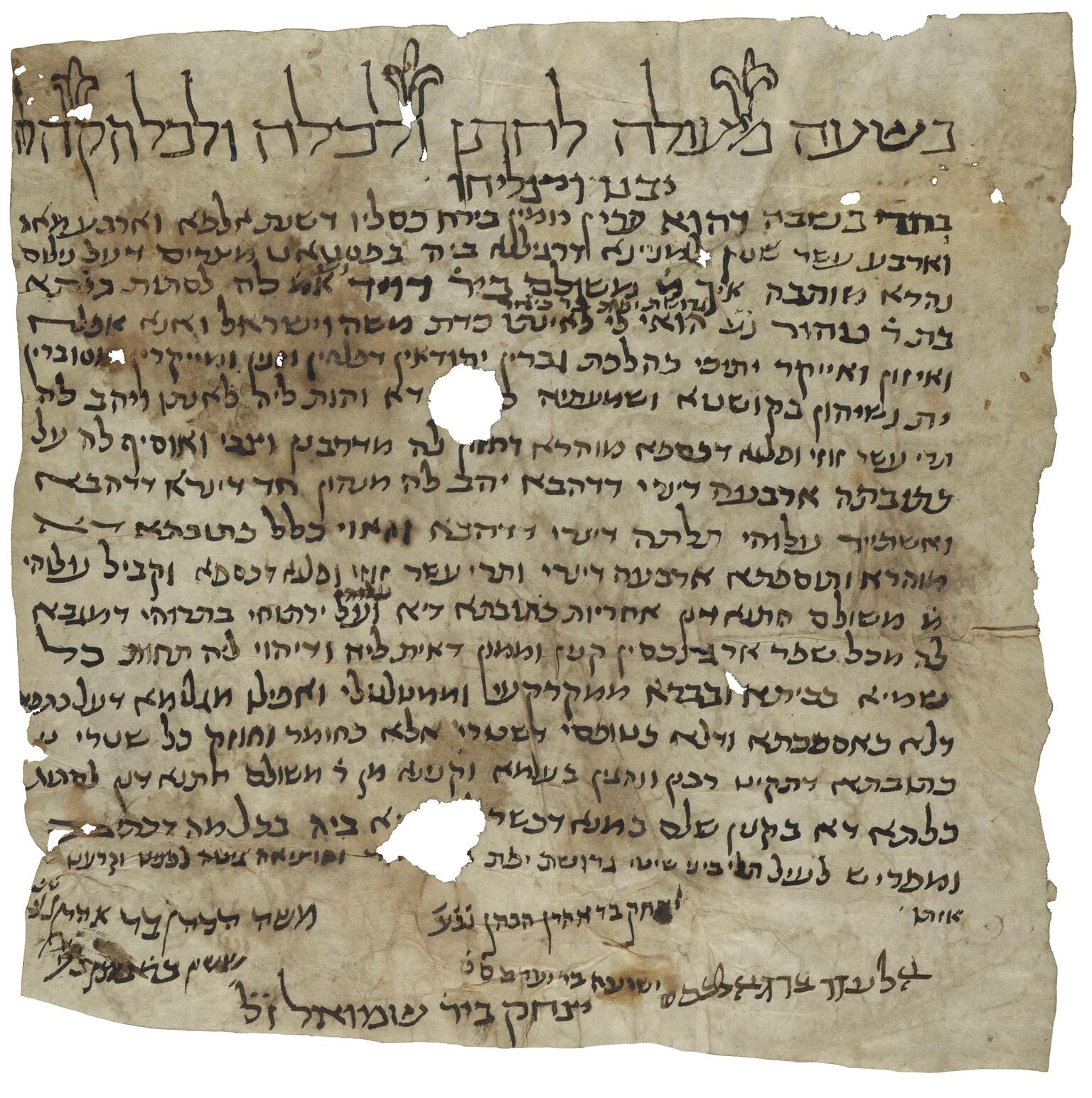 Damaged, stained parchment with vowelless Hebrew script, larger and decorated with floral elements at the top and in an irregular arrangement at the bottom, with two large and several small holes.