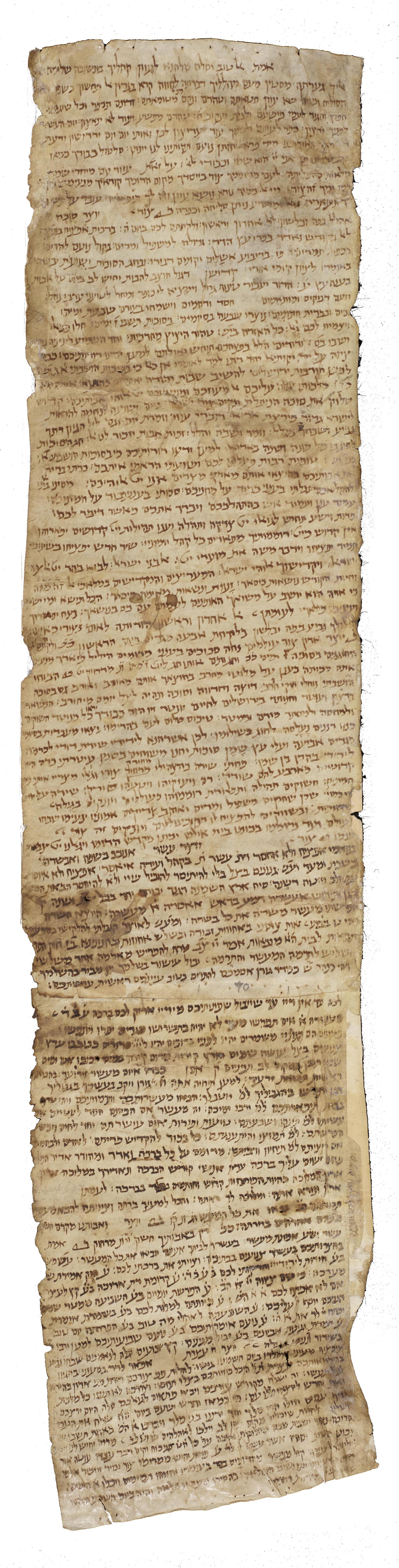 Long, stained parchment scroll with dense Hebrew script.