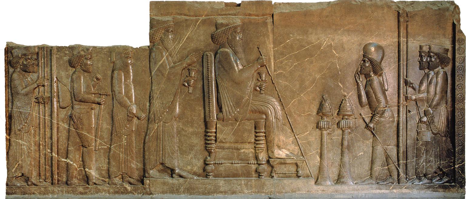 Relief of man sitting on throne with figures standing on either side.