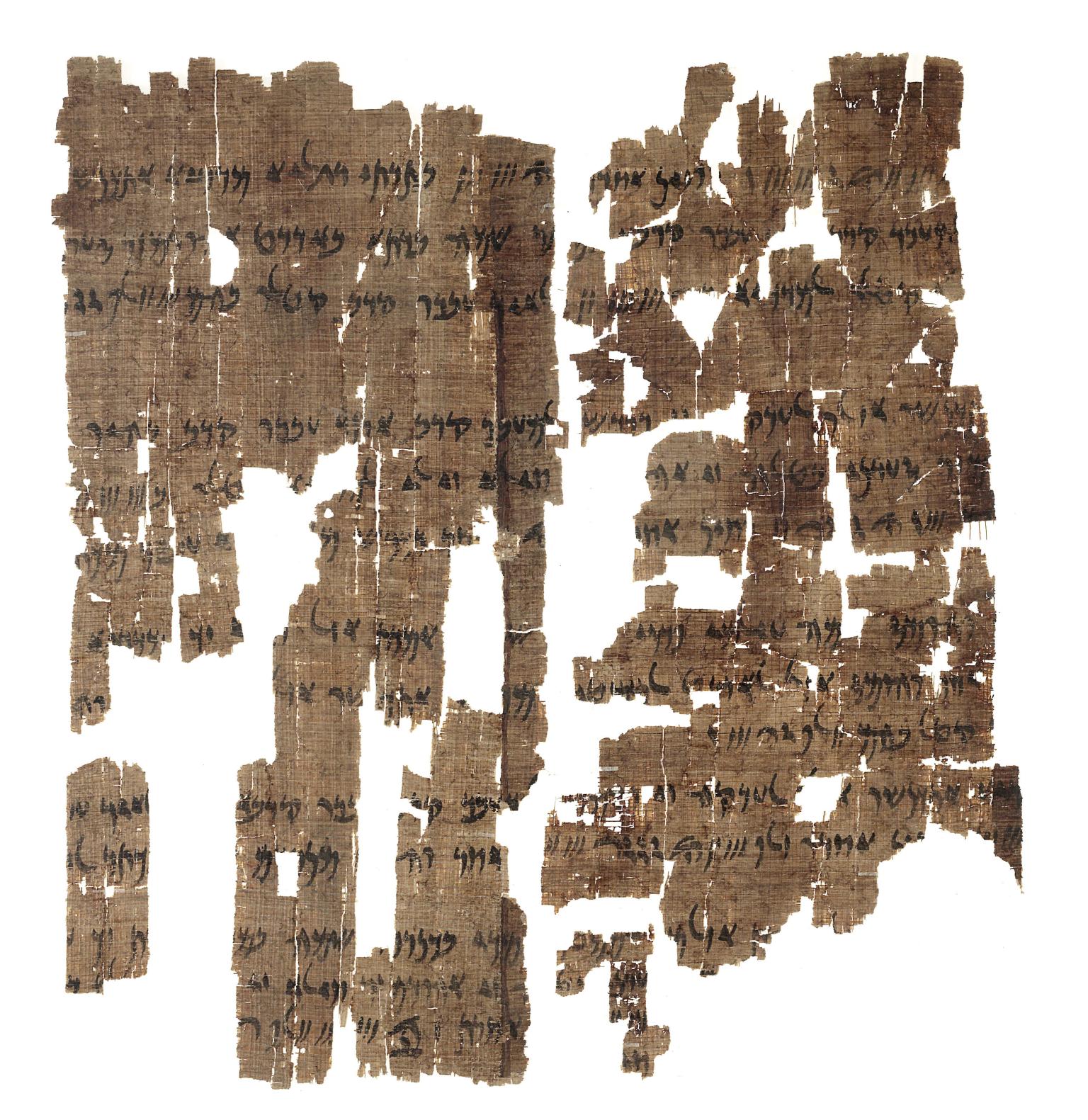 Fragmentary papyrus in several pieces with Aramaic writing. 