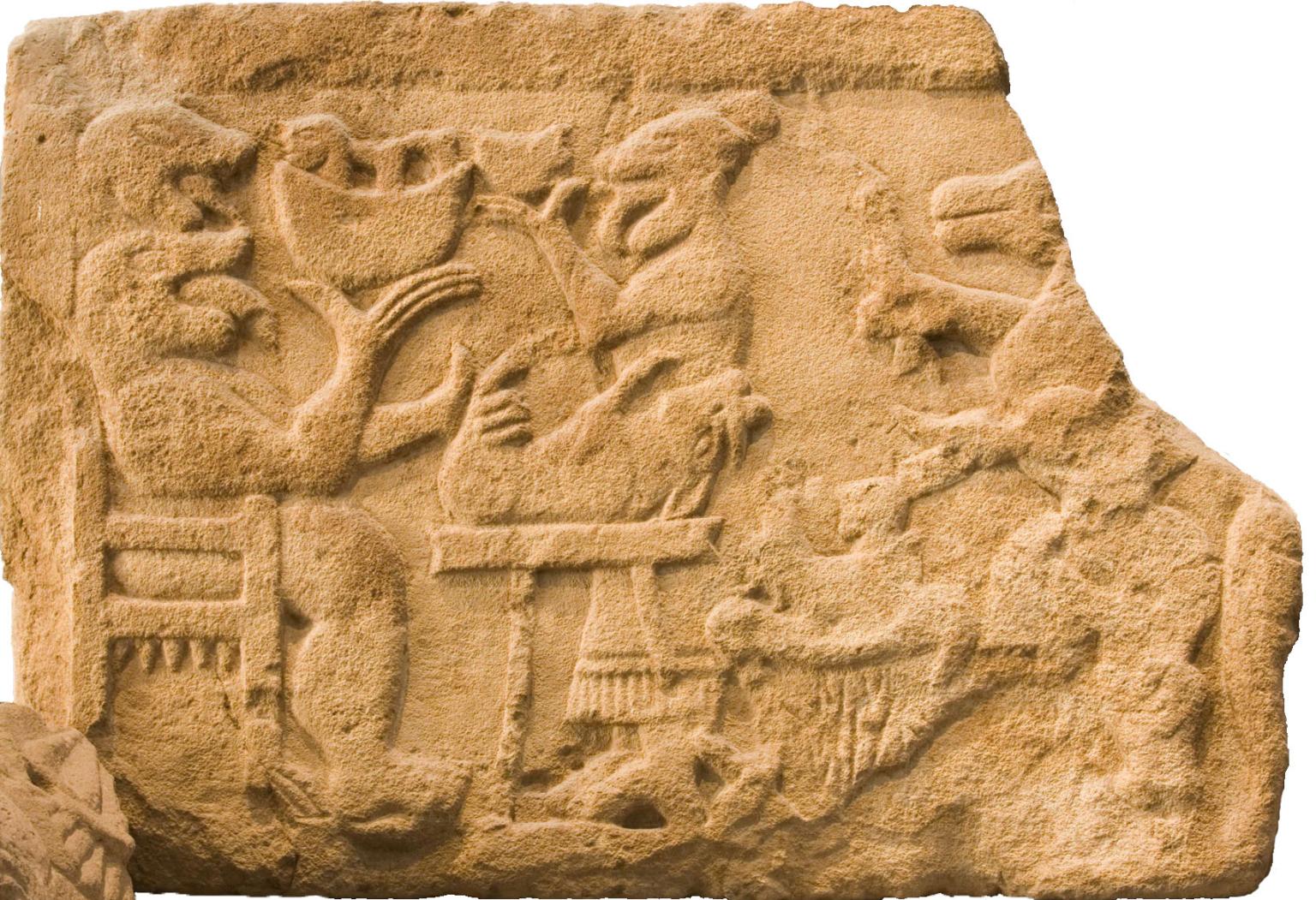 Stone relief of human-like monster in a chair and several animals and figures.