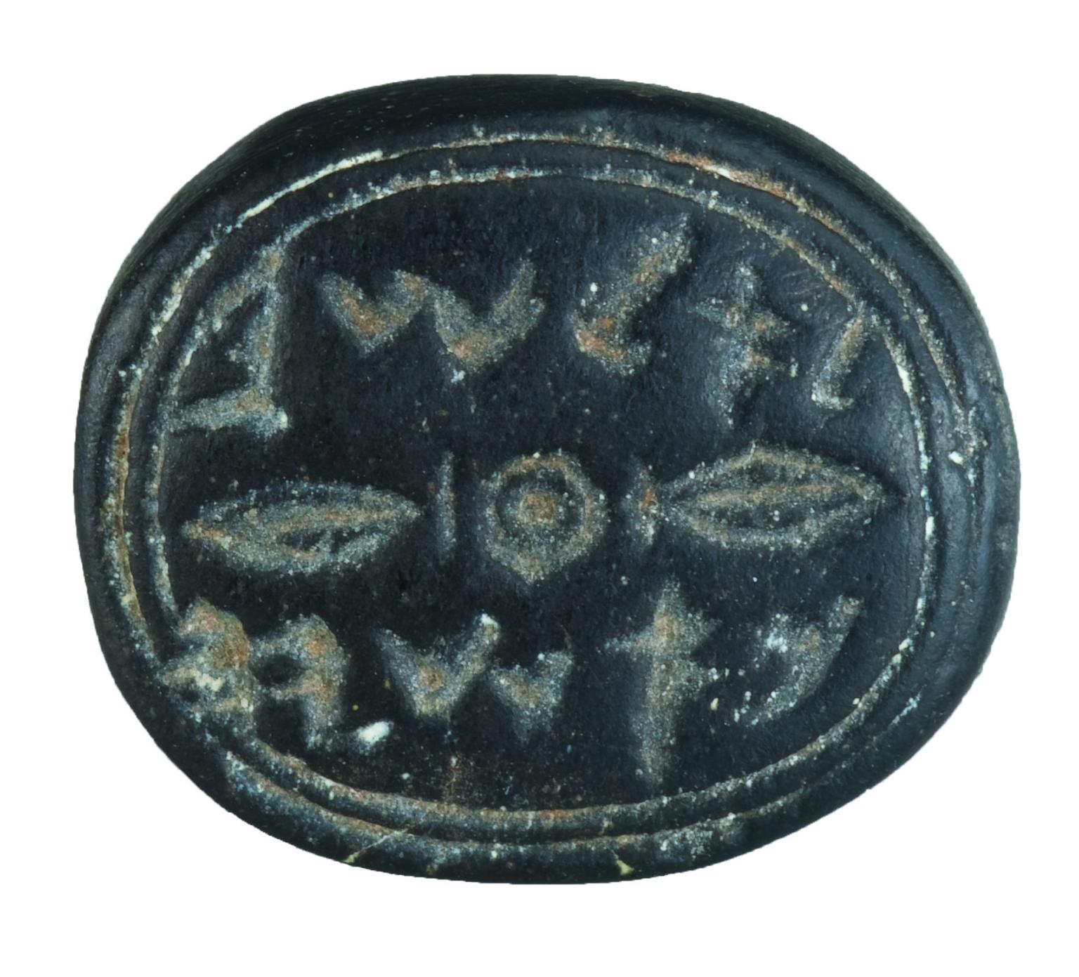 Black seal decorated with a double-line border surrounding Hebrew inscription.